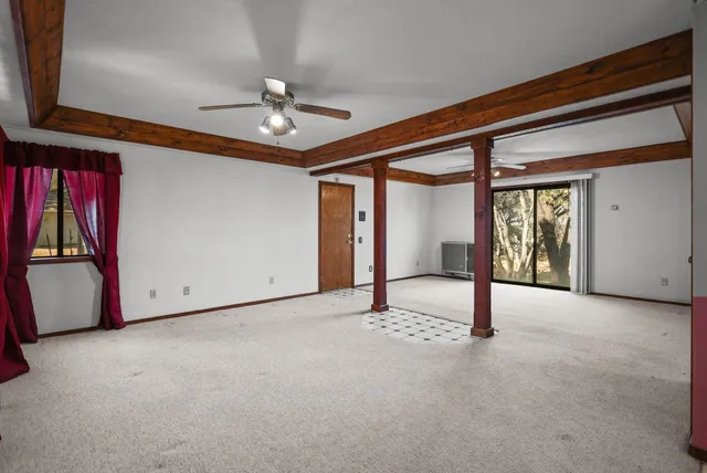 a view of a house with backyard and porch