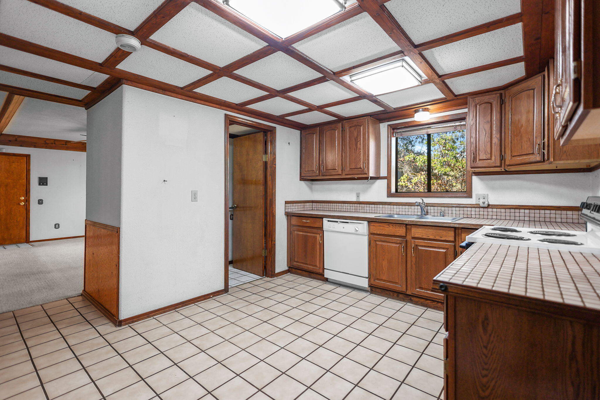 28424 Alpine Way Shingletown, CA 96088 - Photo 10 of 42 a kitchen with a sink cabinets and window