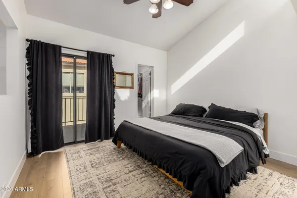 a bedroom with a bed and window