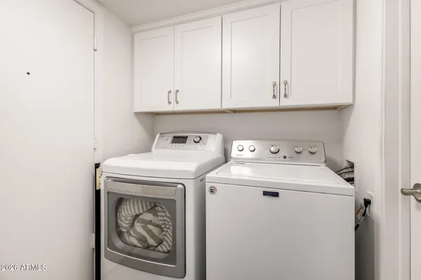a utility room with dryer and washer