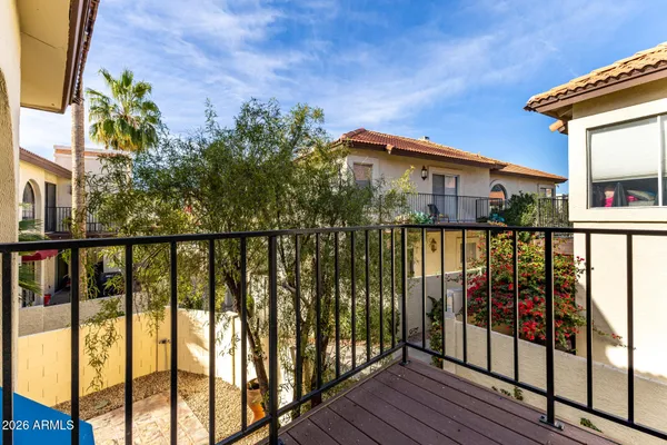 a view of a houses from a balcony