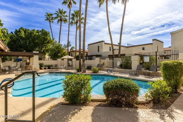 a view of a swimming pool with a patio