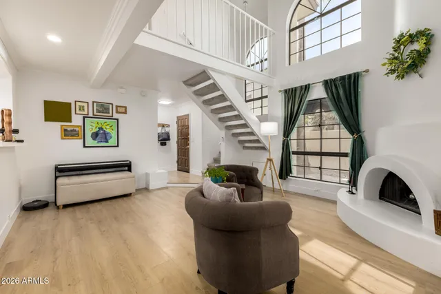 a living room with furniture and a fireplace
