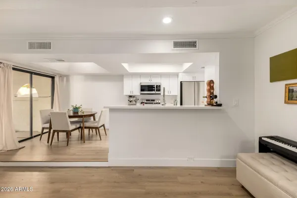 a view of a dining room with furniture and wooden floor