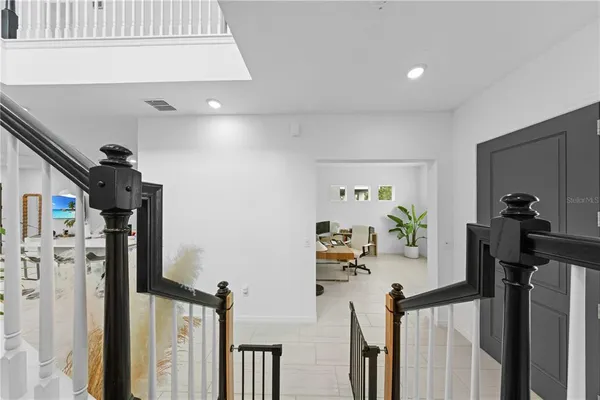 a view of a hallway with dining area