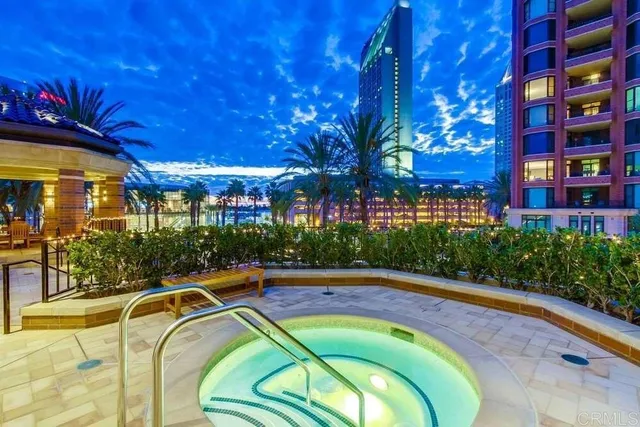 a swimming pool with outdoor seating and yard