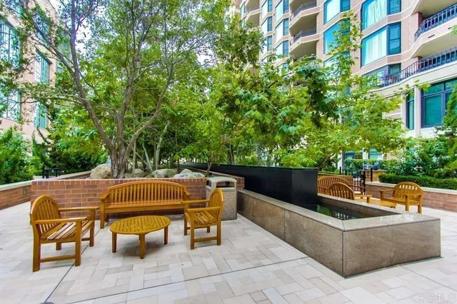 a outdoor sitting area with furniture and garden