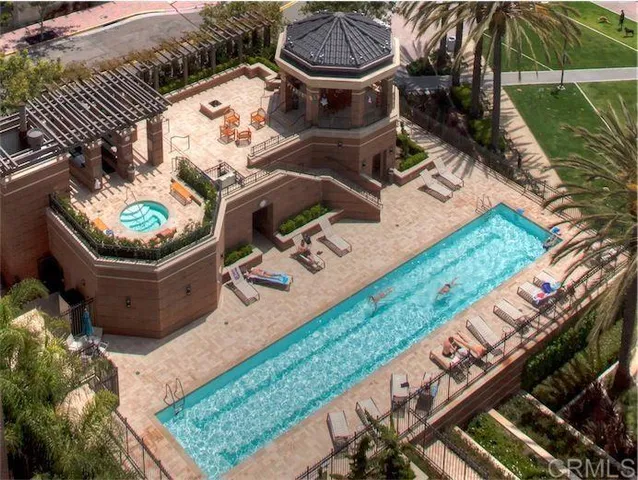 a view of a backyard with chairs and a grill
