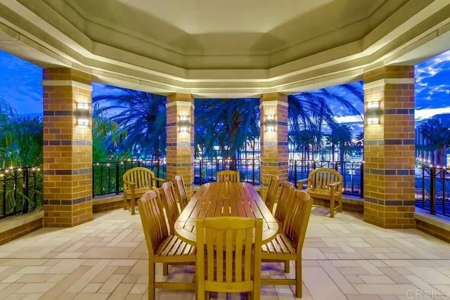 a dining room with furniture and chandelier