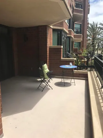 a view of a swimming pool with outdoor seating
