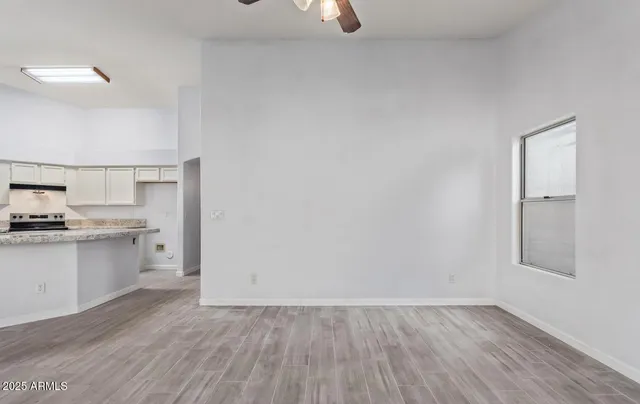 a view of a kitchen with a stove top oven
