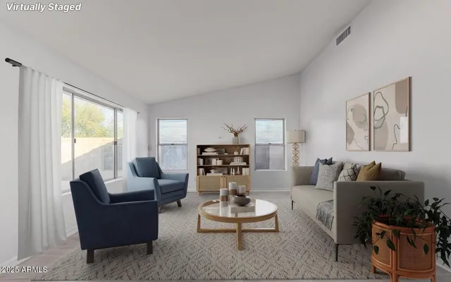 a living room with furniture and white walls