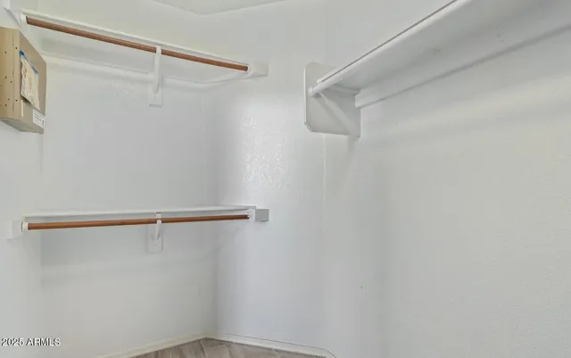 a view of an empty walk in closet