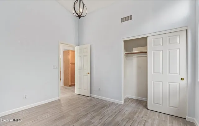 a bathroom with a granite countertop sink toilet and a mirror