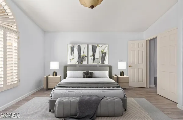 a bedroom with a bed and window