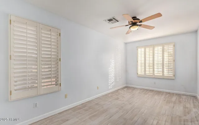 a view of room with a ceiling fan