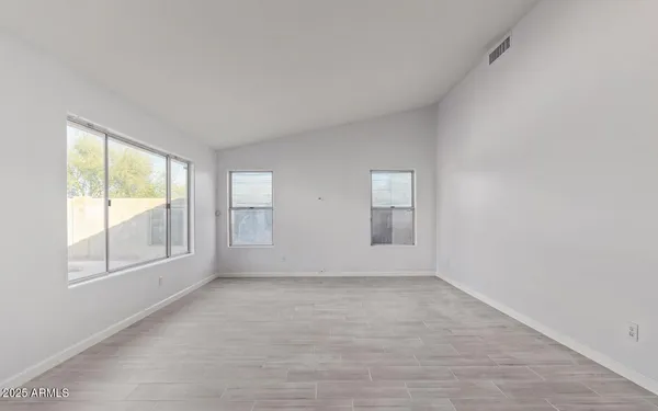 an empty room with windows