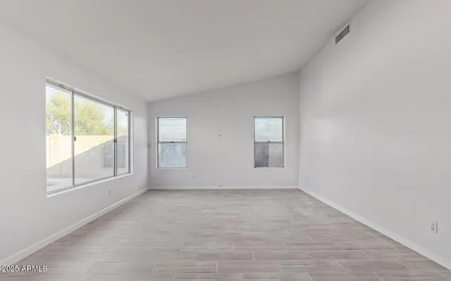 an empty room with windows