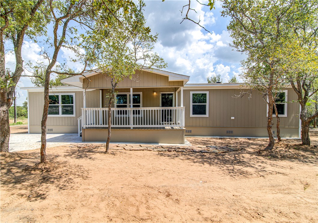 149 Sunflower Rd Dale Dale, TX 78616 - Photo 1 of 1 a house with trees in the background