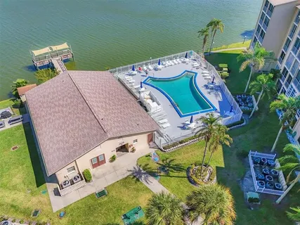 an aerial view of a house with a swimming pool