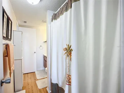 a bathroom with a shower curtain and a curtain