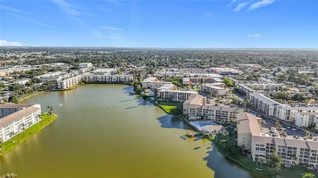 an aerial view of a city with ocean view