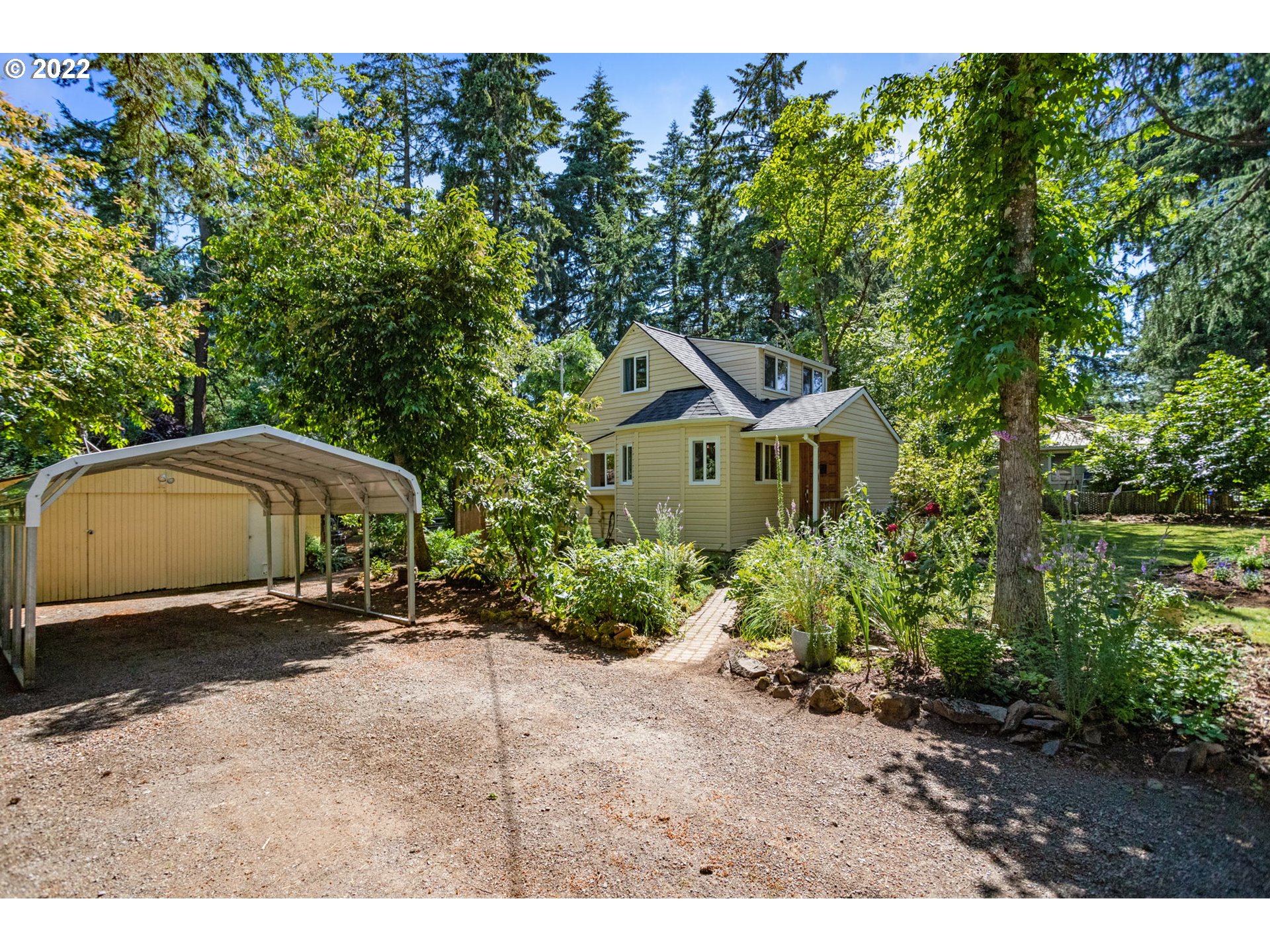 2020 Southeast Waldron Road Milwaukie, OR 97222 - Photo 2 of 32 a front view of a house with a yard