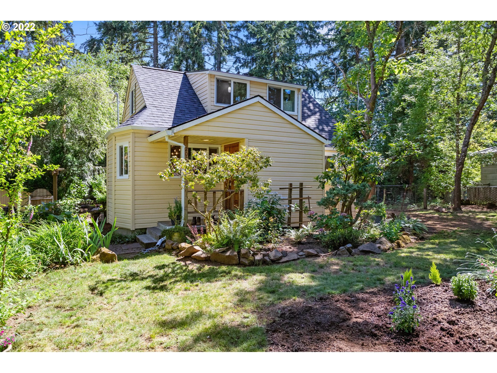 2020 Southeast Waldron Road Milwaukie, OR 97222 - Photo 3 of 32 a view of a house with a yard and plants