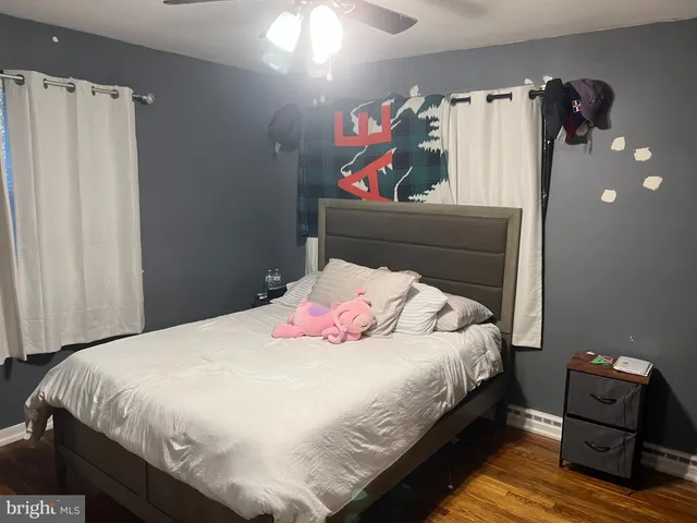 a bedroom with a bed and a view of bathroom