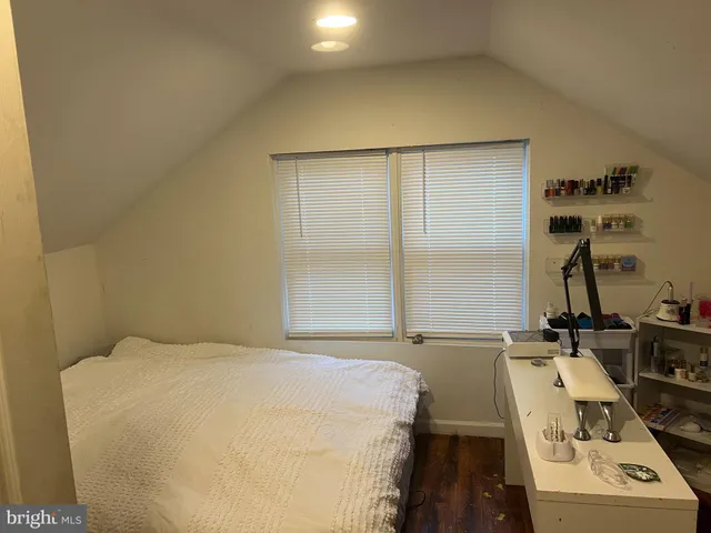 a bedroom with a bed and a table
