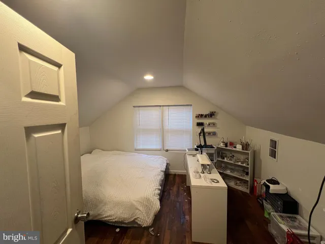 a bed room with a bed and a window