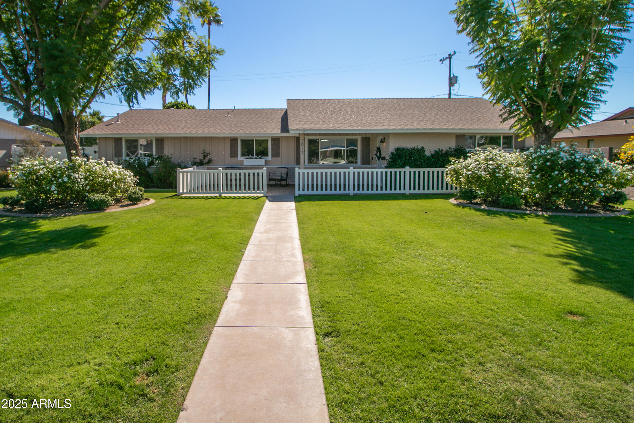 2017 West Edgemont Avenue Phoenix, AZ 85009 - Photo 1 of 53 a front view of a house with yard and green space