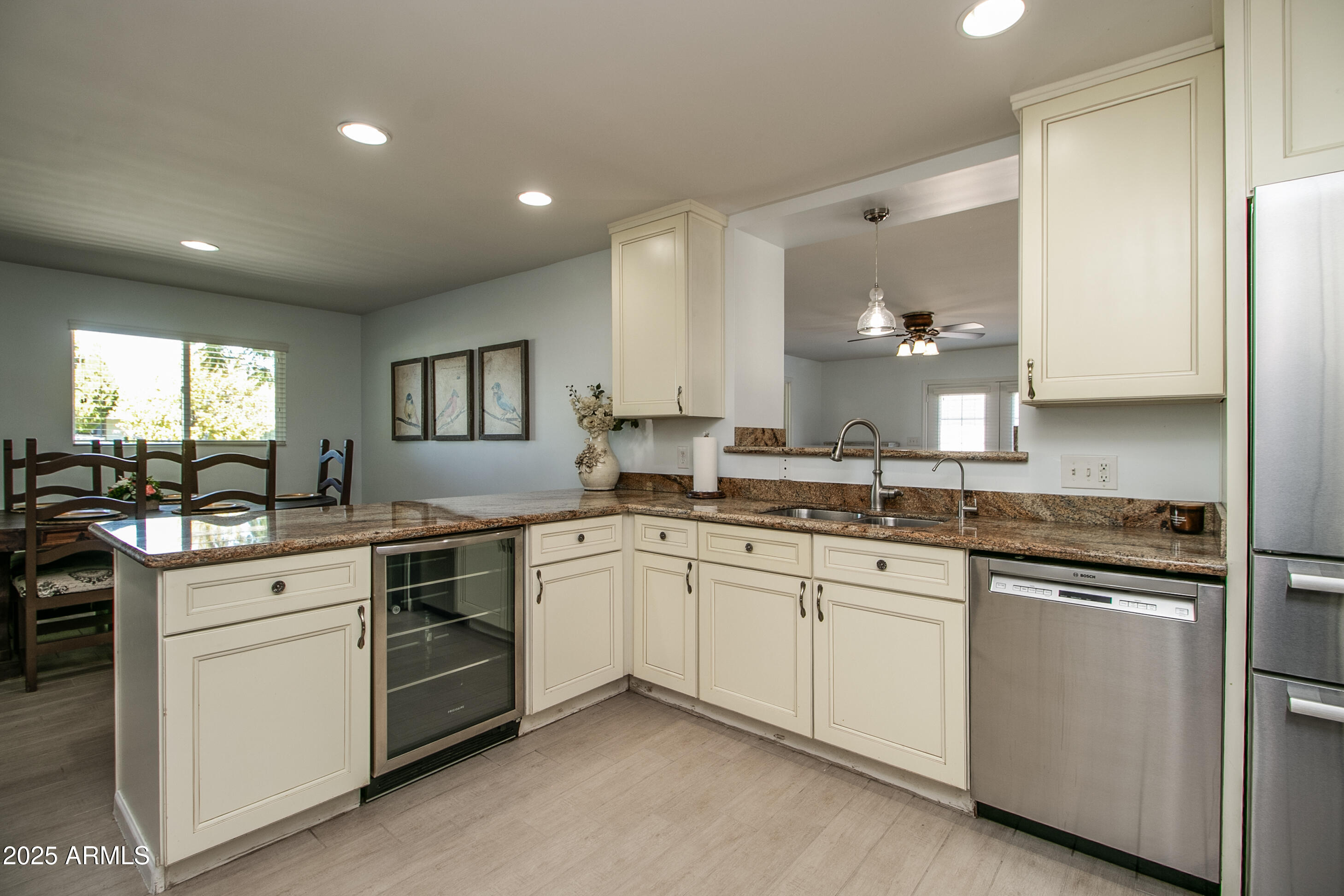 2017 West Edgemont Avenue Phoenix, AZ 85009 - Photo 15 of 53 a kitchen with white cabinets sink and stove