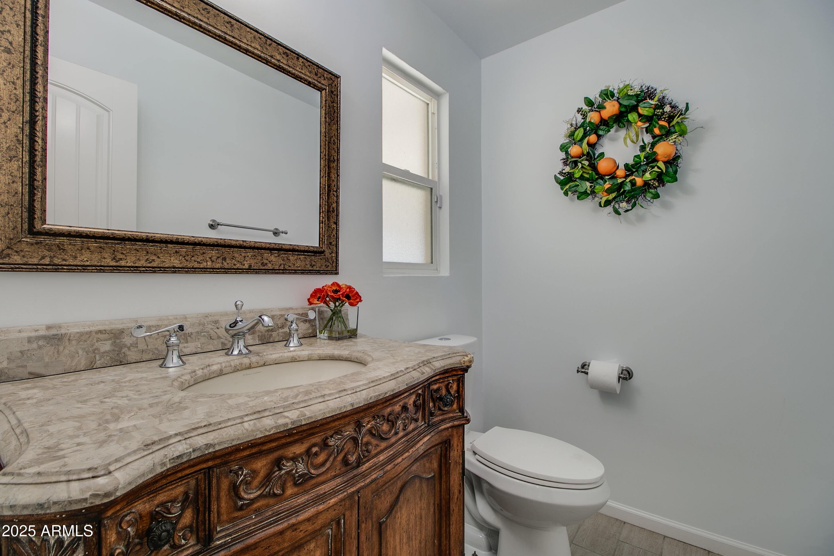 2017 West Edgemont Avenue Phoenix, AZ 85009 - Photo 17 of 53 a bathroom with a granite countertop sink and a toilet