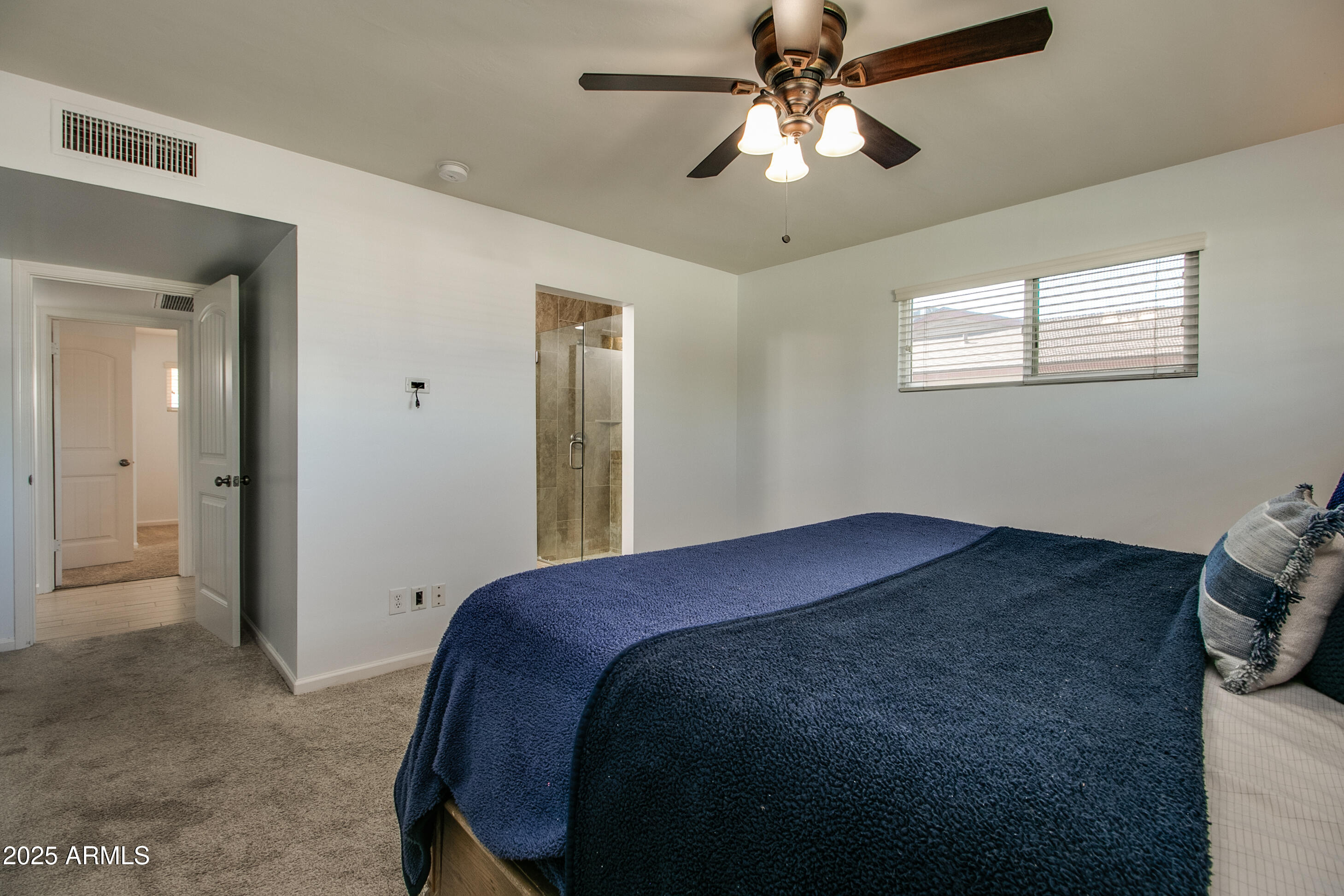 2017 West Edgemont Avenue Phoenix, AZ 85009 - Photo 23 of 53 a bedroom with a bed and a chandelier
