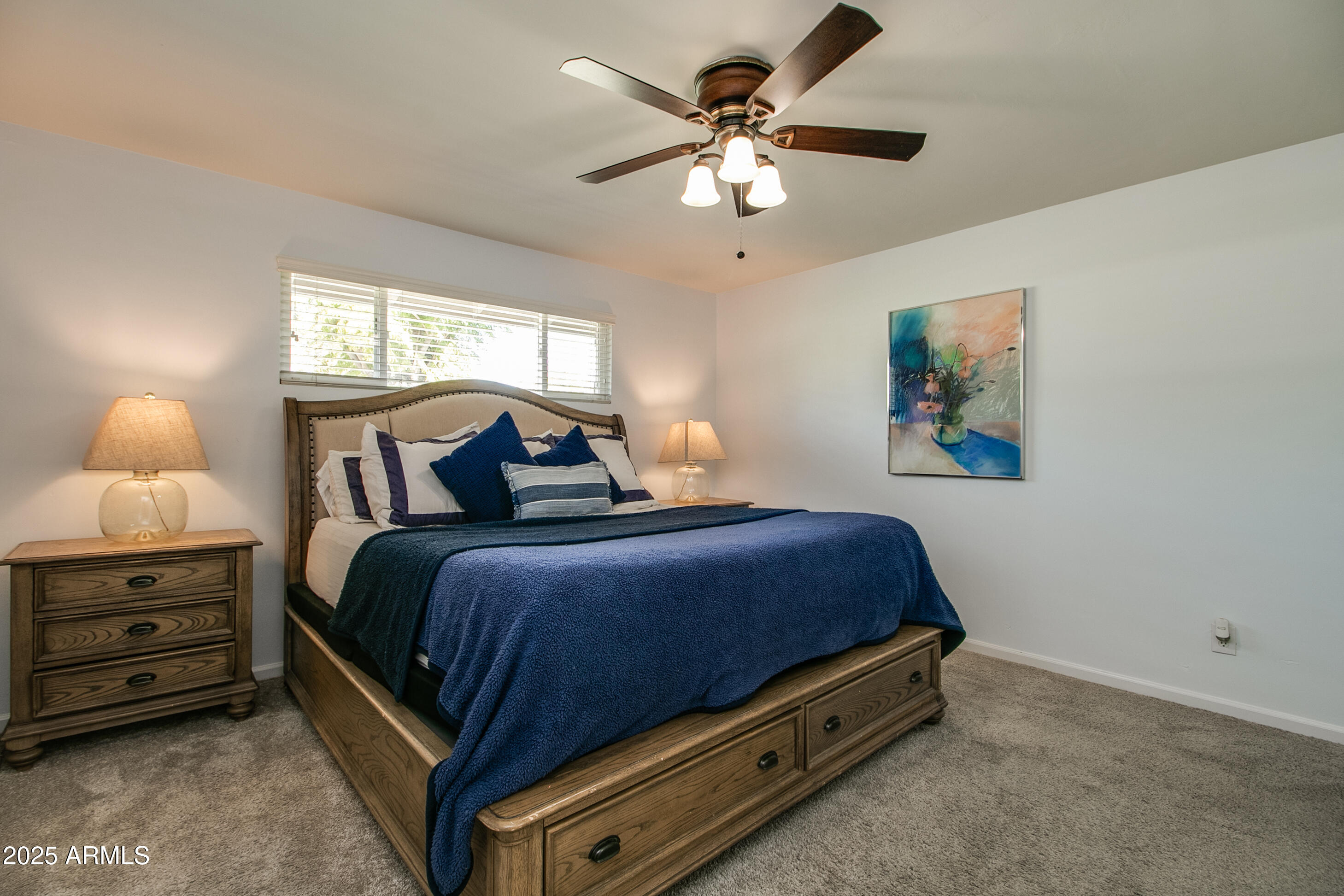 2017 West Edgemont Avenue Phoenix, AZ 85009 - Photo 24 of 53 a bedroom with a bed and a chandelier