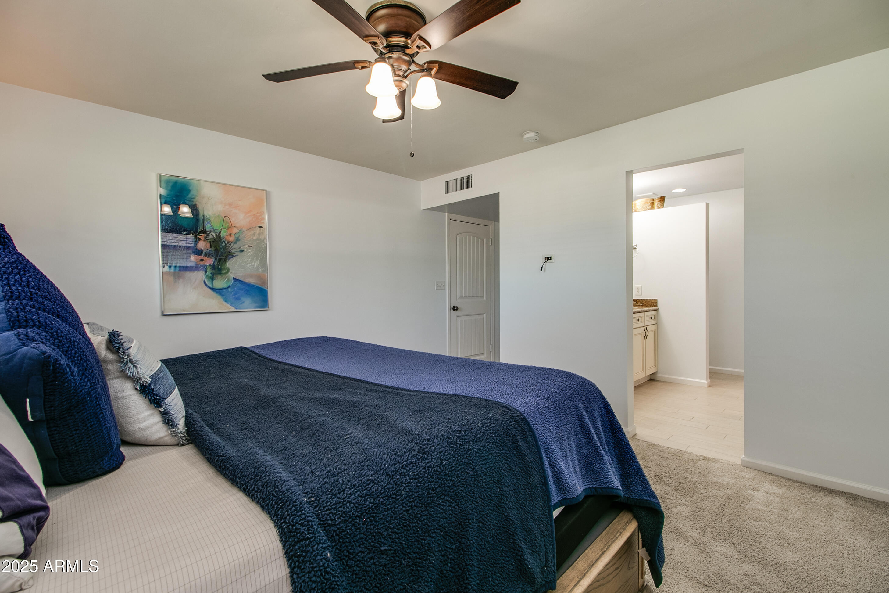 2017 West Edgemont Avenue Phoenix, AZ 85009 - Photo 25 of 53 a bedroom with a bed and a chandelier