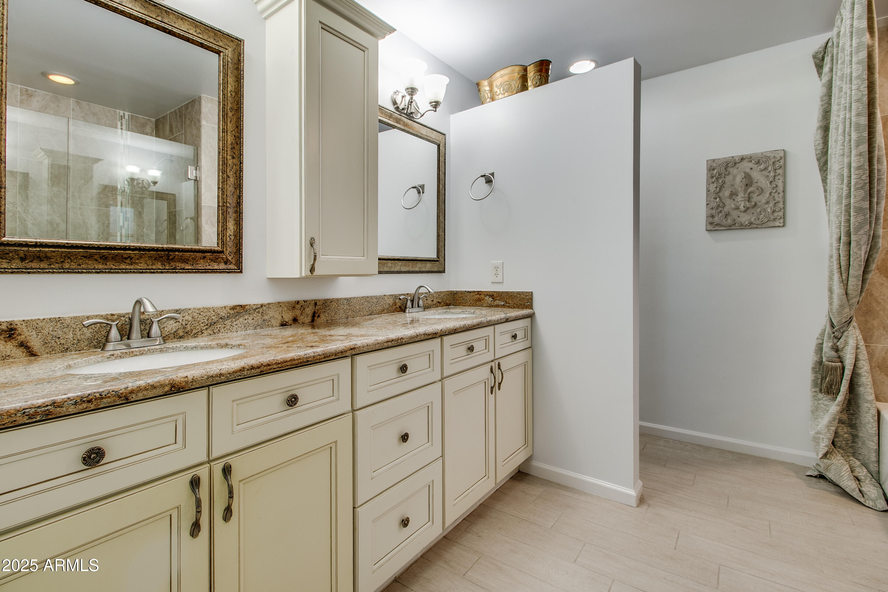 2017 West Edgemont Avenue Phoenix, AZ 85009 - Photo 26 of 53 a bathroom with a granite countertop sink and a mirror