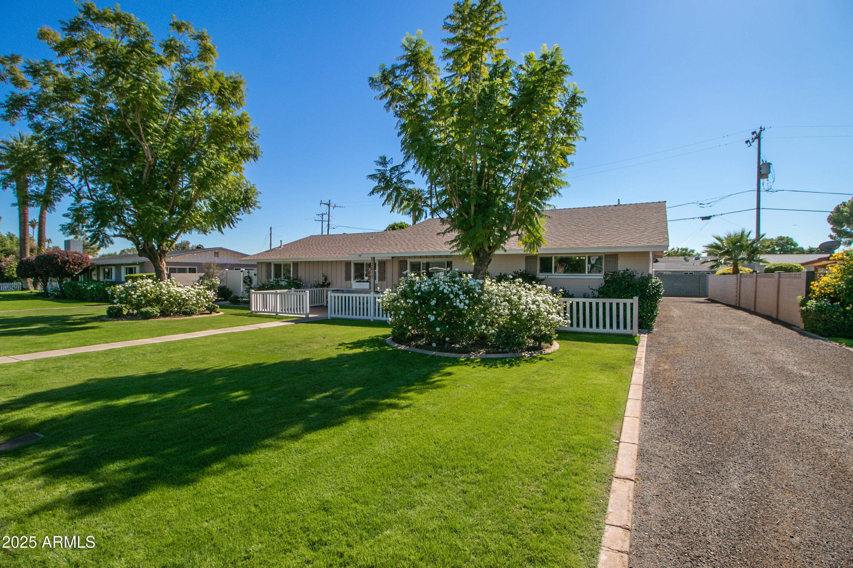 2017 West Edgemont Avenue Phoenix, AZ 85009 - Photo 2 of 53 a front view of a house with garden