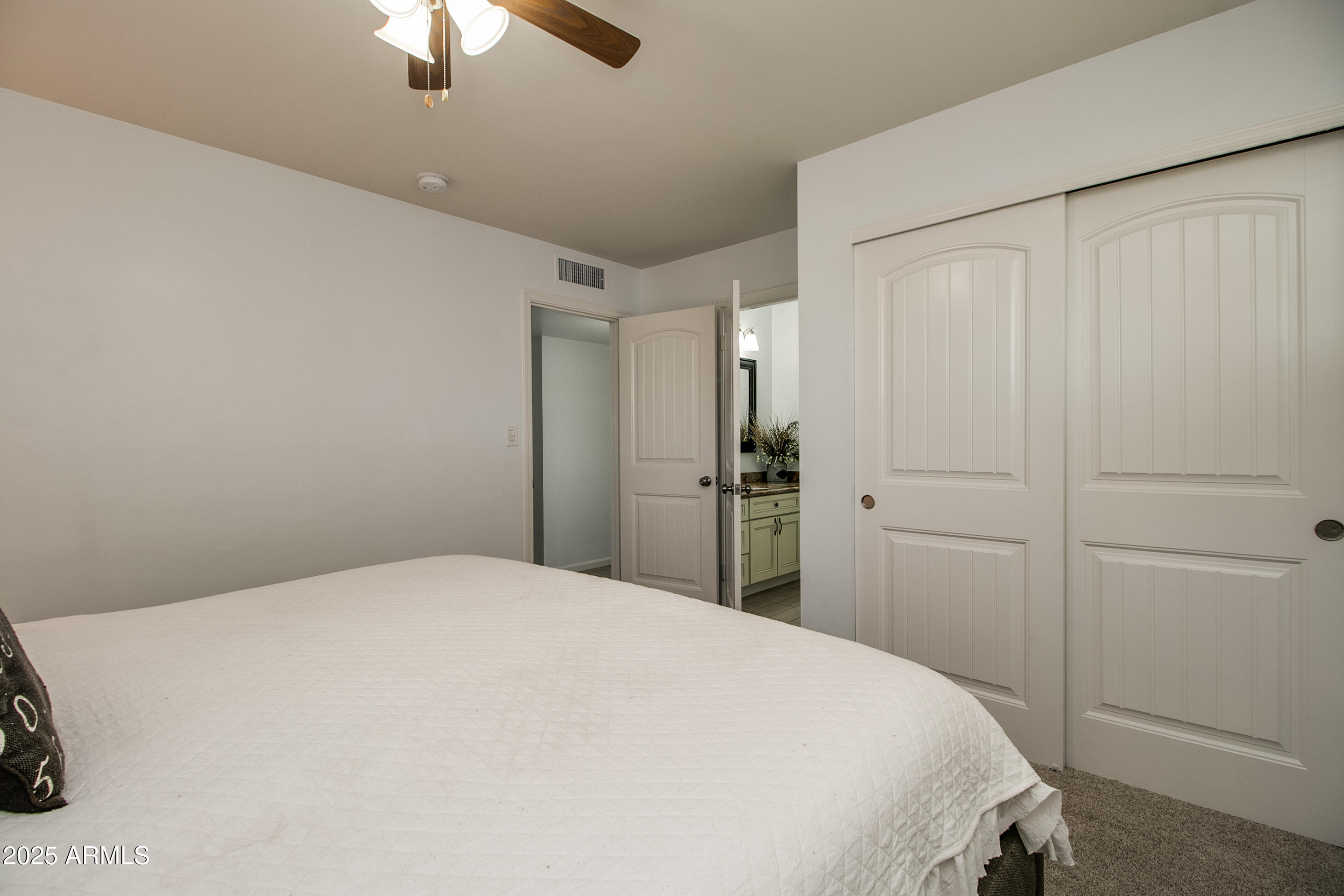2017 West Edgemont Avenue Phoenix, AZ 85009 - Photo 33 of 53 a bedroom with a bed and a chandelier fan