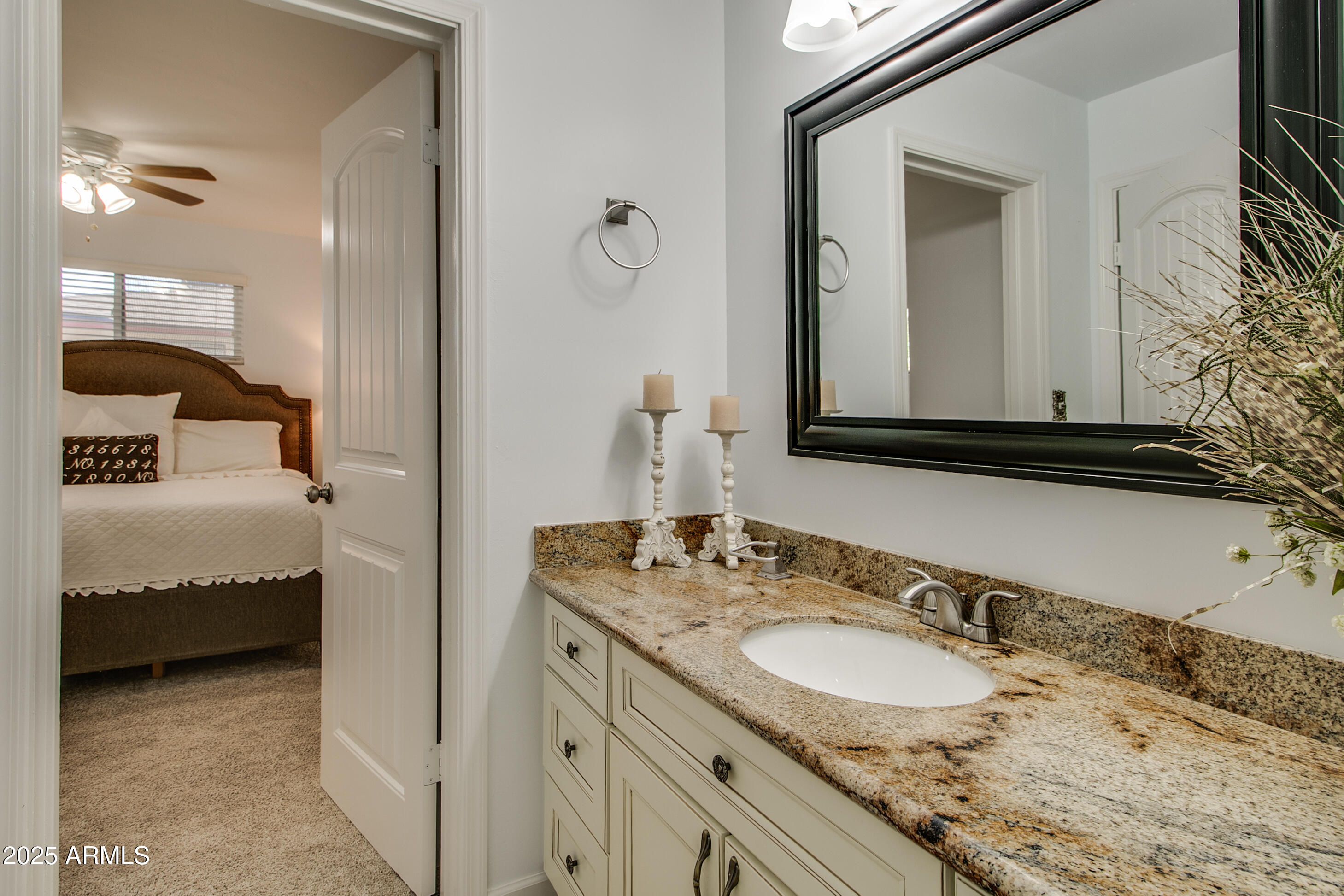 2017 West Edgemont Avenue Phoenix, AZ 85009 - Photo 35 of 53 a en suite bathroom with a double vanity sink and a mirror