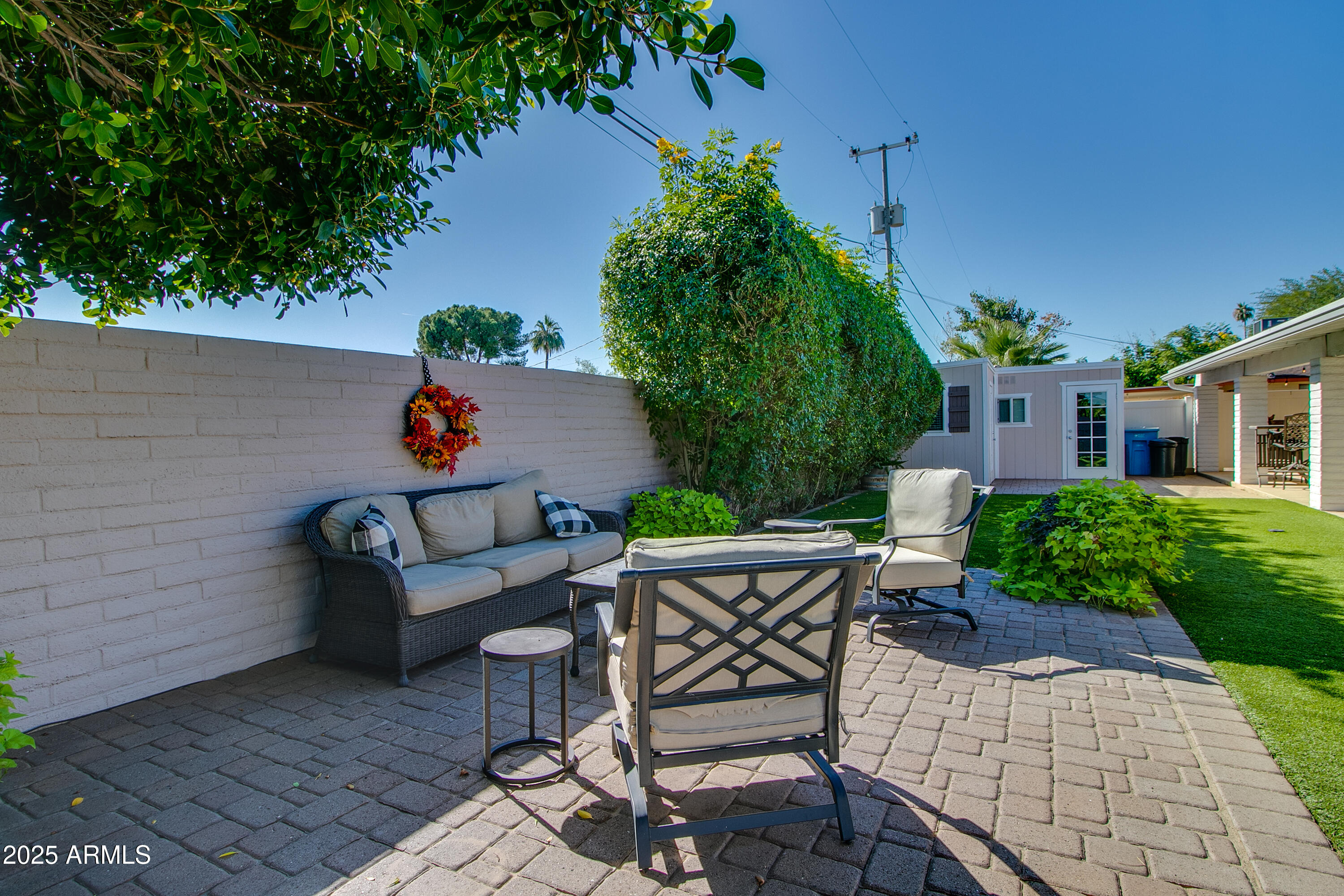 2017 West Edgemont Avenue Phoenix, AZ 85009 - Photo 39 of 53 a backyard of a house with table and chairs