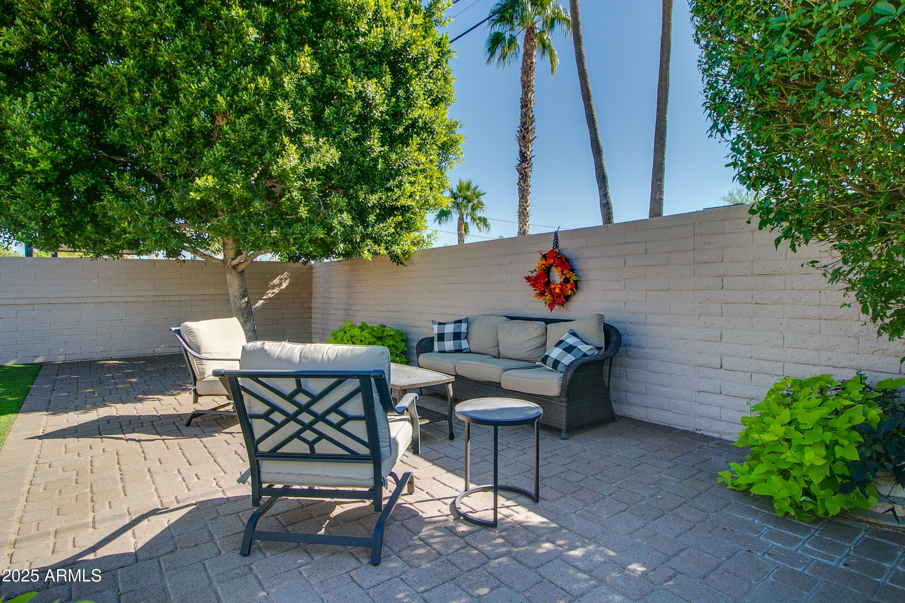 2017 West Edgemont Avenue Phoenix, AZ 85009 - Photo 40 of 53 a backyard of a house with table and chairs