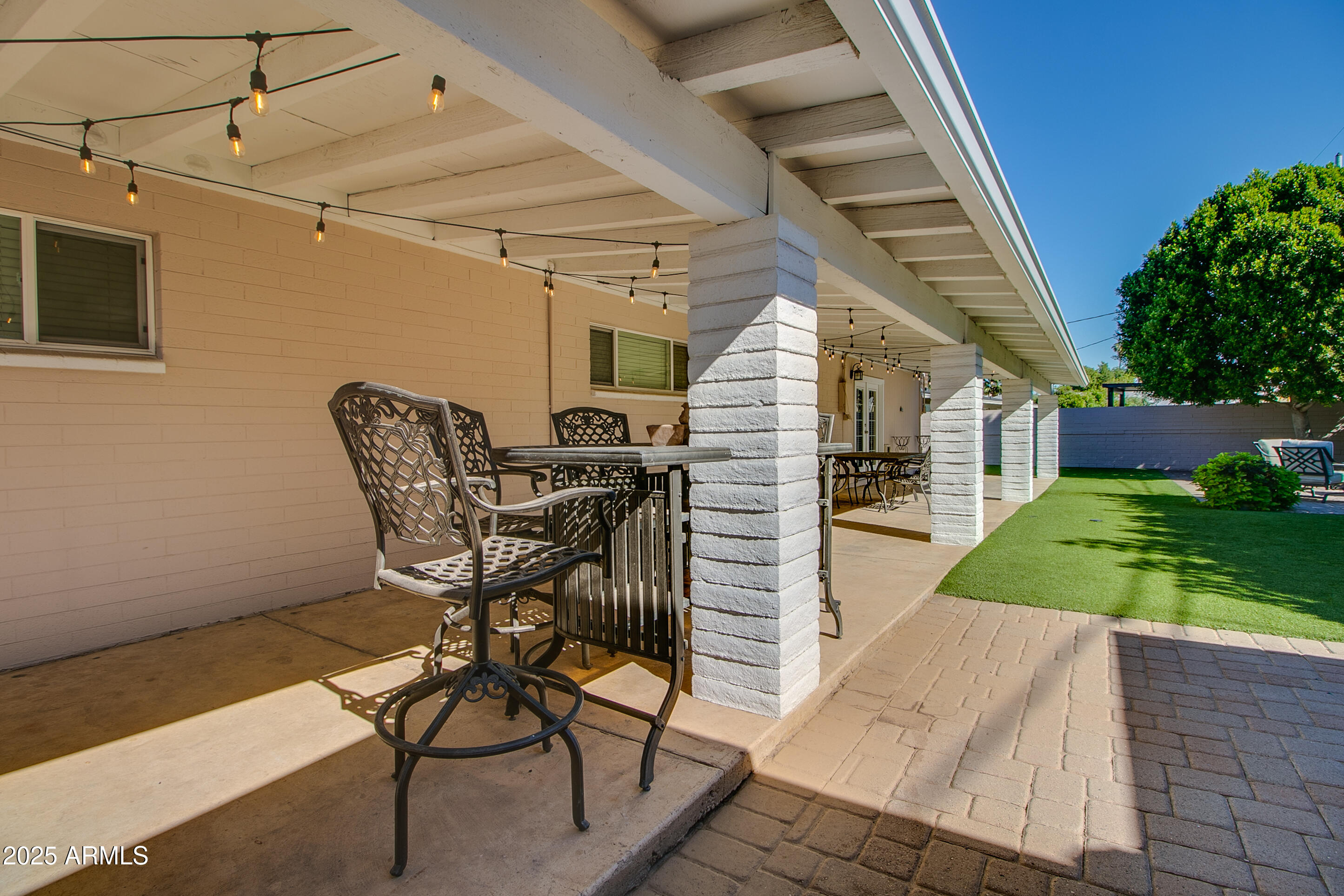 2017 West Edgemont Avenue Phoenix, AZ 85009 - Photo 45 of 53 a view of a patio with table and chairs with wooden floor and fence