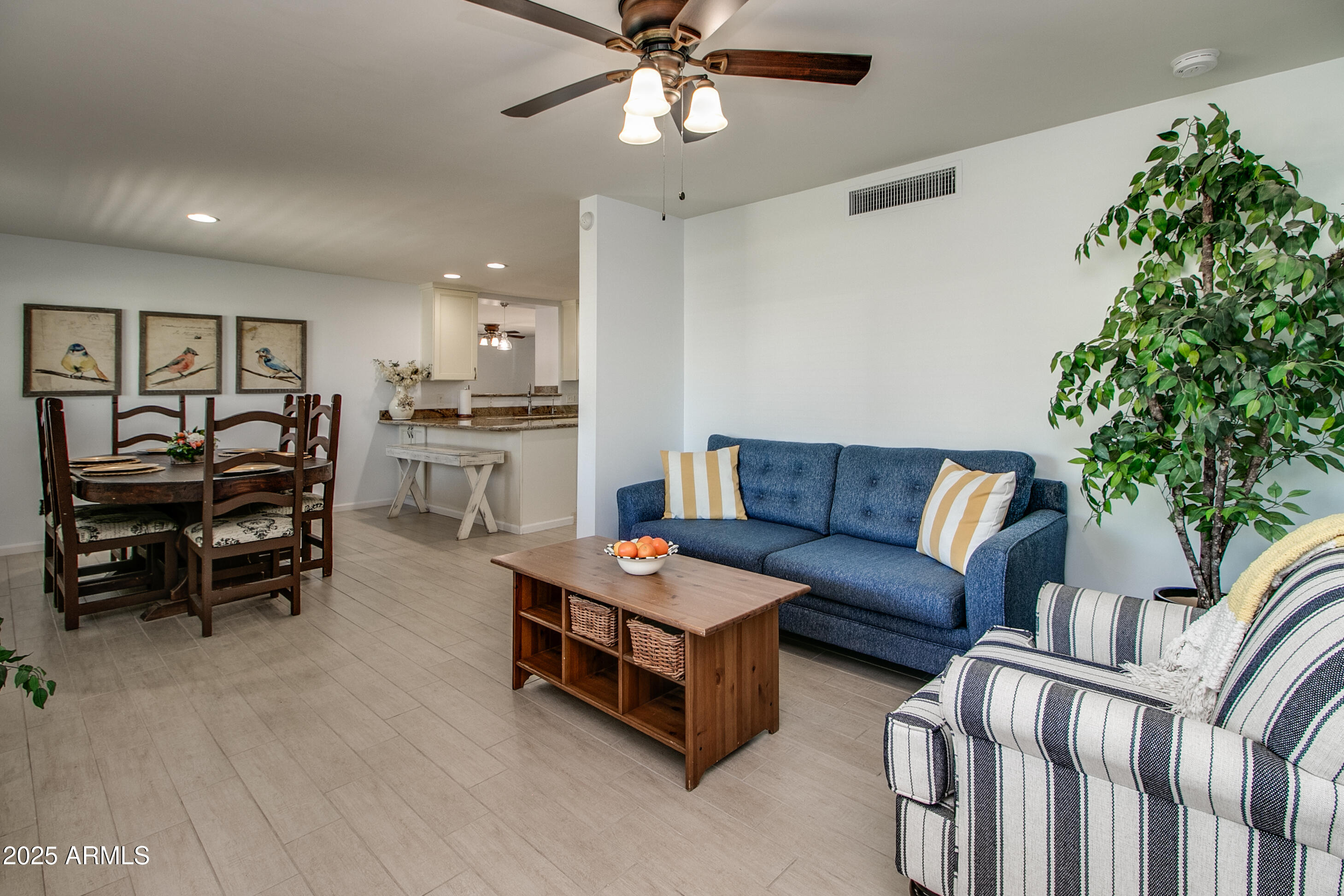 2017 West Edgemont Avenue Phoenix, AZ 85009 - Photo 5 of 53 a living room with furniture a chandelier fan and a window