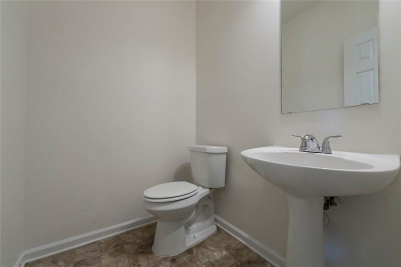 6045 Capitol Knoll Fairburn, GA 30213 - Photo 17 of 37 a bathroom with a sink toilet and a mirror