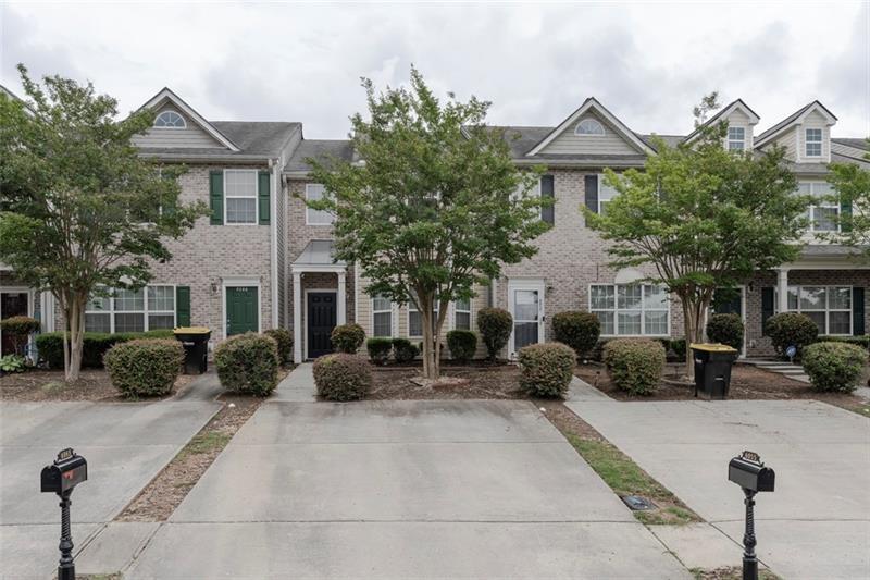 6045 Capitol Knoll Fairburn, GA 30213 - Photo 2 of 37 a front view of a house with a yard and potted plants