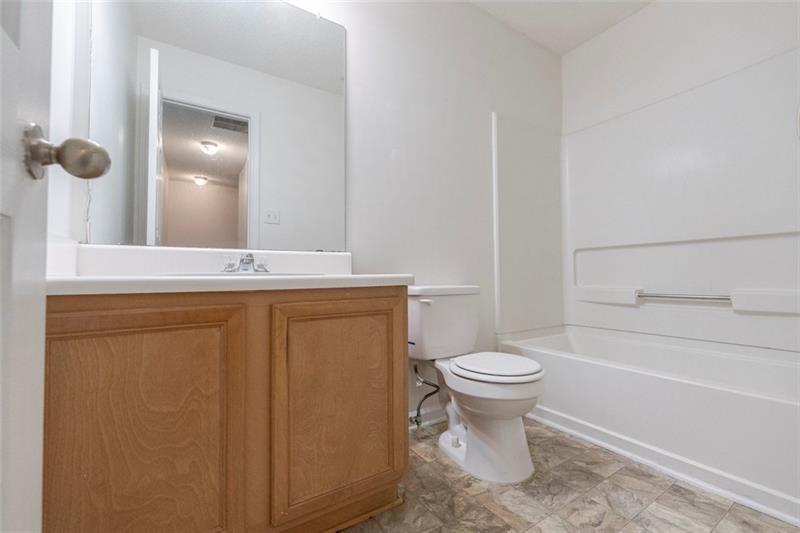 6045 Capitol Knoll Fairburn, GA 30213 - Photo 27 of 37 a bathroom with a sink toilet and shower