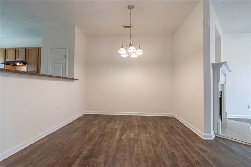 6045 Capitol Knoll Fairburn, GA 30213 - Photo 9 of 37 a view of a room with wooden floor and a window