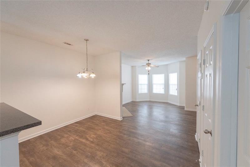 6045 Capitol Knoll Fairburn, GA 30213 - Photo 10 of 37 a view of a room with window and wooden floor